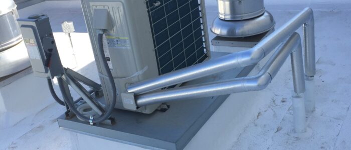 Mini split install on a commercial rooftop platform.