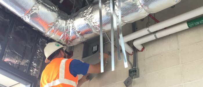 Legit Air, Guy repair duct on a ladder