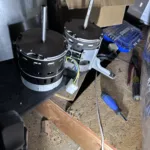 Certified Legit Air technician diagnosing and repairing a modern furnace in a Fullerton, California home attic space