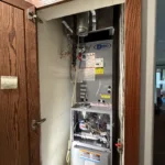 open hvac hall closet shows a legit air new ac pro furnace installation in closet of fullerton ca home