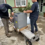 2 certified legit air hvac technicians prepping a new furnace in front of a Fullerton ca home